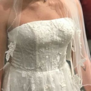 Strapless never worn ivory wedding dress with beautiful floral aplique